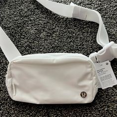 White Lululemon everywhere belt bag. New with tags, never worn Cream Lululemon Belt Bag, Lululemon White Belt Bag, White Lulu Belt Bag, Tj Maxx Purses, Lululemon Fannypack, Orlando Outfits, Lululemon Accessories, Lululemon Backpack