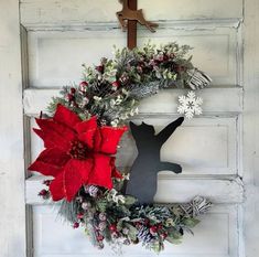 a christmas wreath hanging on the front door