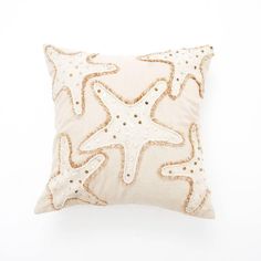 a starfish pillow on a white background