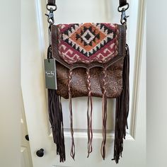 Brand New, Never Worn Myra Bag Brown Leather With Long Fringe Embroidered Front Magnetic Snap Pockets Inside And Outside Adjustable Strap Leather Bag With Fringe, Embroidered Brown Crossbody Shoulder Bag, Brown Embroidered Crossbody Shoulder Bag, Embroidered Leather Crossbody Bag, Red Embroidered Leather Shoulder Bag, Red Embroidered Leather Bag, Long Fringe, Long Fringes, Tooled Leather