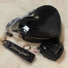 Selling As Bundle Only New With Tag Never Used Cross Posted Victoria’s Secret Black Heart Shape Crossbody Bag Victoria’s Secret Black Rhinestone Logo Keychain Strap Victoria’s Secret Black Zippered Heart Shape Pouch Keychain Add A Little Romance To Your Everyday Style With This Heart-Shaped Accessory. 3.9"L X 0.94"W X 3.4"H Top Zip Luxury Black Heart-shaped Shoulder Bag, Luxury Black Heart-shaped Bag, Dream Purse, Keychain Strap, Pouch Keychain, Heart Shaped Bag, Bath And Body Works Perfume, Heart Bag, Pretty Bags