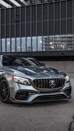 the mercedes s - class coupe is parked in front of a building