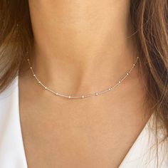 ✔️A satellite chain necklace that upgrades your everyday look.✔️ This satellite choker is great for wearing alone or for layering with other necklaces. It is the perfect gift for your girlfriend, sister, bridesmaids, or even yourself! >>IS IT A GIFT? This minimalist necklace comes in a beautiful gift package. If you wish to send a personal message, please make a comment at the checkout process! >>SIZE This beaded chain choker is available in length of 12, 13, 14, 15 , 16, 17, 18, 19 Minimalist Sterling Silver Choker With Delicate Chain, Minimalist Choker With Satellite Chain, Minimalist Satellite Chain Choker Jewelry, Minimalist Satellite Chain Choker, Minimalist Clavicle Chain Choker, Minimalist Necklaces, Dainty Chain Necklace, Layered Chokers, Necklace Cute