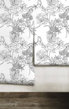 two sheets with flowers on them sitting next to each other