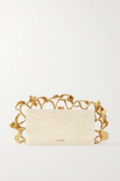 It's the carefully considered details that separate Cult Gaia's bags and make them feel like wearable works of art. This 'Fana' clutch is made from ivory marbled acrylic and framed with gold-tone brass leaves - they're inspired by the lush greenery from the Garden of Eden. The compact interior offers enough space for the essentials. Gold Clutch Bag, Classy Purses, Cult Gaia Bag, The Garden Of Eden, Gold Clutch, Gold Bag, Evening Handbag, Garden Of Eden, The Cult