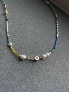 Rainbow beaded necklace is handmade from the best materials. You can buy it as a gift for a friend, sister, mother. BEADS SIZE : The pearls are 3-9mm (0.11 - 0.35 inch), and the beads are 2-4mm (0.07 - 0.13 inch). The LENGHT: The length is adjustable. You can choose your size. If you need a custom size feel free to write, I'll make a custom size choker for you. IMPORTANT: A chain is added to each choker for additional control. IMPORTANT INFORMATION: *Created in a pet-free and smoke-free home. * White Necklaces With Colorful Beads For Friendship, White Letter Beads Necklace For Friendship, Trendy Heart-shaped Beaded Necklaces For Gifts, Cute Handmade Necklaces For Friendship, Cute White Beaded Chain Necklace, Trendy Handmade Friendship Necklaces, Trendy Handmade Necklaces For Friendship, Handmade White Beaded Necklaces With Heart Shape, Heart-shaped Beaded Pearl Necklace As Gift