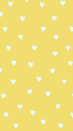 a yellow background with white hearts on it