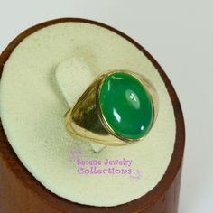 Simply and pretty chrysoprase smooth cabochon ring set in 18k yellow gold. Ring Size: 8.25 Total Weight: 8.23 grams Precious Metal: 18k Yellow Gold Precious stones: -Chrysoprase Center Stone: 6.5 carats, 15mm x 11.8mm Hallmark: 18k Formal Green Cabochon Rings, Green Opal Oval Ring In 14k Gold, Green Signet Ring With Oval Cabochon Gemstone, Green Oval Cabochon Gemstone Signet Ring, Green Oval Cabochon Signet Ring, Yellow Gold Jade Cabochon Ring, Classic Round Chrysoprase Rings, Green Oval Cabochon Signet Ring As Gift, Green Oval Cabochon Signet Ring For Gift