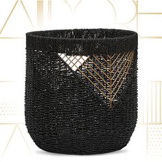 a black basket with gold details on the front and side, against a white background