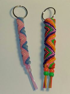 two key chains with different colored beads on them