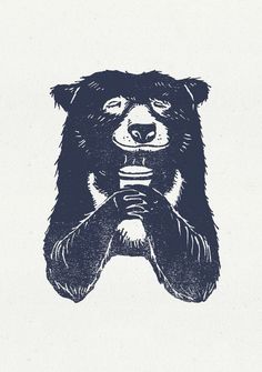 a black and white drawing of a bear holding something in its paws with both hands