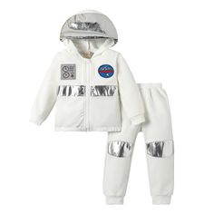 a white jacket and pants with silver foil on the bottom, and an astronaut patch on the front