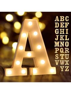 a light up letter with lights around it and the letters in front are lit up