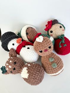 several crocheted stuffed animals sitting next to each other