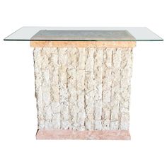 a glass and stone table with a wooden base on it's side, against a white background