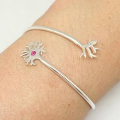 Silver Neuron Bracelet is handmade with its own uniqueness. It can be bought as a gift for any occasion like birthday gift, wedding gift, travel gift, souvenir and etc. If you need rose gold plating or yellow gold plating, please contact us, we will advice you on the additional fees applicable.Base Material: Sterling Silver Size: 19mm X 24mm (Approximately)Stone: Red CZBangle wrist size: Adjustable / Please give us your wrist circumference.Thickness: 1.5mm / 0.059 InchMetal Stamped: 925Crafting Unique Nickel-free Bracelets As Gifts, Unique Nickel-free Bracelets For Gifts, Pink Sterling Silver Bracelet As A Gift, Pink Sterling Silver Bracelet For Gift, Unique Pink Bracelets As Gift, Unique Pink Bracelets For Gifts, Unique Sterling Silver Bracelets As A Gift, Handmade Sterling Silver Rose Gold Bracelet, Metal Stamping