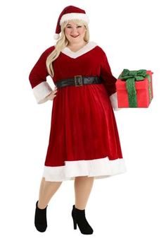 a woman dressed as santa claus holding a present