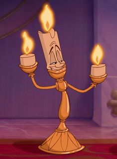 a cartoon character holding two candles in their hands