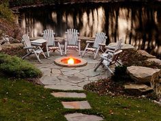 a fire pit with chairs around it and the words top useful backyard fire pit ideas