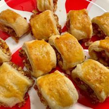 several pastries on a red and white plate