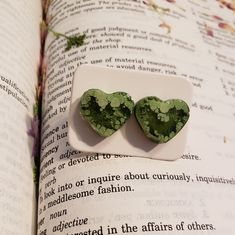 These New With Tag Heart Shaped Stud Earrings Are Handmade In Tucson Arizona By Me! They Are Made With A 2 Part Epoxy Resin That Is Nontoxic! However You Should Obviously Not Eat Them. These Take 36 Hours To Complete From Sanding To Shining And Applying The Stainless Steel Stud. These Ones Have A Dark Meadow Green With A Lighter Green Surrounding! Last Photo For Reference On How They Sit On The Ear! I Have Lots Of Other Colors So Please Check Em Out! Measurements: ~2 Cm Across ~.5-1 Cm Wide Dark Meadow, Handmade Heart, Heart Stud Earrings, Tucson Arizona, Heart Studs, Heart Earrings Studs, Sanding, Tucson, Epoxy Resin