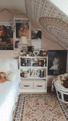 a bedroom with a bed, bookshelf and pictures on the wall