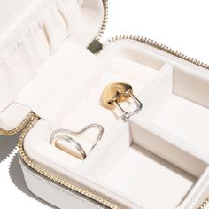 DESCRIPTION You'll never have to worry about losing your most precious pieces with our stylish and portable jewelry box. Use it to organize your wedding day jewelry and store it for years to come! Great for traveling (especially for a bachelorette weekend or on your honeymoon!) Features double compartments 'Mrs' text with cute heart icons is pressed at the top of the box DIMENSIONS & MATERIALS The jewelry box measures 10 cm (L) x 10 cm (W) x 5 cm (H) Made of Saffiano vegan leather The inner mate Elegant Portable Rectangular Jewelry Case, Gold Rectangular Jewelry Storage Case For Gift, Elegant Portable Rectangular Jewelry Storage Case, Elegant Portable Jewelry Storage In Rectangular Case, Compact Portable Jewelry Storage For Gift, Elegant Portable Rectangular Jewelry Storage, Elegant Rectangular Keepsake Jewelry Storage, Modern Rectangular Jewelry Storage For Gift, Elegant Gold Round Case Jewelry Storage