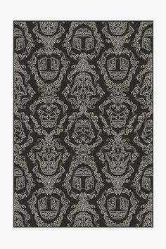 a black and white pattern with skulls on it