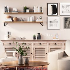 a living room filled with furniture and pictures hanging on the wall above it's coffee table