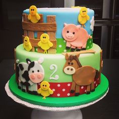 a birthday cake with farm animals on it