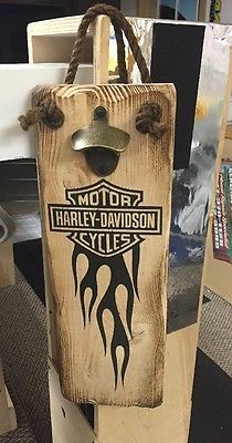 a wooden sign that says harley davidson cycles on it's front and back ends