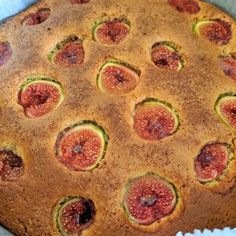 a cake that is sitting in a pan on a table with other food items around it