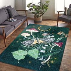 a green rug with flowers and butterflies on it