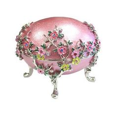 an ornate pink box with flowers on it