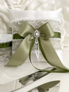 the ring pillow is adorned with a satin ribbon