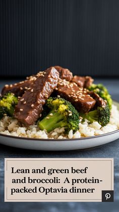 a white plate topped with meat and broccoli on top of rice covered in sesame seeds