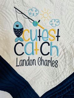 a close up of a quilt with the words cute catch and an owl on it