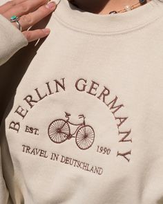 Berlin Germany Sweatshirt! Travel Germany Sweatshirt These sweatshirts and more are hand-made Each article made is locally crafted with heavy input from you! The sweatshirts and color of stitching can be picked according to your desires, and our advanced machine makes it possible to do almost any possible color combination. Kindly feel free to contact us at any time about any questions you might have!! Vintage Style Women, Crewneck Embroidery, Best Travel Gifts, Crewneck Vintage, Embroidery Tshirt, Embroidery Hoodie, Embroidery Shoes, Retro Sweatshirts, Cute Shirt Designs