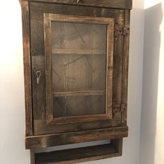 an old wooden shelf is hanging on the wall