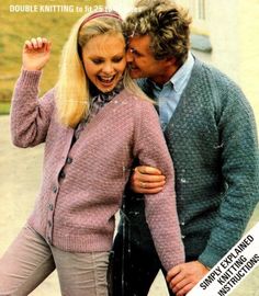 a man and woman in sweaters kissing each other on the cover of a magazine