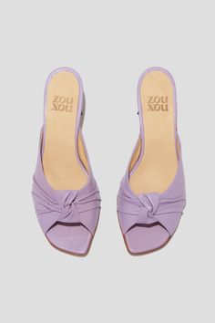 The Greta is a boudoir slipper-inspired mule that captures a playful mix of daytime sensibility & evening refinement. Whether you’re wearing the Greta for daytime play or after-dark doings, you will feel both comfortable and well-turned-out, thanks to a low, triangular heel and a pretty pleated-knot detail at the toe. Style Greta back to loose, casual pants for a breezy date look, or wear them with a cocktail dress to the next wedding on your calendar. Kidskin leather upper, vegetable tanned leather lining, leather outsole. Heel height: 1 ¾ inches (45 mm) Handmade in Argentina Elegant Summer Slip-on Kitten Heels, Chic Summer Slippers With Open Heel, Elegant Summer Slippers With Flat Heel, Summer Evening Mules With Open Heel, Summer Evening Open Toe Slippers, Spring Cocktail Open Toe Mules, Summer Evening Mules With Flat Heel, Summer Evening Flat Heel Mules, Formal Open Toe Slippers For Summer