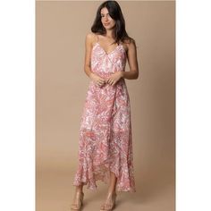 Unleash your inner bohemian goddess in our Sleeveless Paisley Print Maxi Dress. Made from a luxurious combination of polyester and lurex, this faux wrap dress is both comfortable and stylish. The ruffle side and high low design add a touch of femininity to this soft pink dress. Shine bright in this must-have piece! Soft Pink Dress, Faux Wrap Dress, Romper Pants, Printed Maxi, Printed Maxi Dress, Shine Bright, Paisley Print, Dress Accessories, Dress Collection