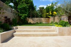 an outdoor garden with steps leading up to it