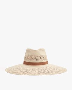 Wide-brimmed hat with perforated pattern and a ribbon band. Woven Toquilla Straw Hat With Flat Brim, Brimmed Woven Toquilla Straw Hat, Woven Straw Panama Hat With Flat Brim, Woven Straw Hat With Flat Brim For Warm Weather, Flat Brim Woven Straw Hat For Warm Weather, Straw Crochet Hat For Warm Weather, Chic Braided Straw Hat, Elegant Braided Straw Hat For Beach, Woven Toquilla Straw Hat With Short Brim