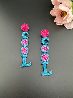 This is a beautiful Quirky beaded Earrings in Blue and Pink Cool(worded earrings) design. Very light weight to wear and looks good on any attire. This is very beautiful to look at and a perfect one for regular wear and also parties.  Color : Blue, Pink length : 4 inch width : 0.75 inch Each earring Weight : 3.7 grams Material : Beads, Fabric Beautiful High Quality, premium jewelry. Free US standard shipping. Hand crafted in India with the finest design, this earring is of premium quality and uni Fun Beaded Earrings For The Beach, Fun Beaded Earrings For Beach, Fun Dangle Earrings For Festivals, Fun Dangle Earrings For Festival, Trendy Blue Beaded Earrings, Trendy Dangling Beads Earrings For Beach, Trendy Adjustable Beaded Earrings With Dangling Beads, Trendy Beach Earrings With Dangling Beads, Trendy Blue Earrings With Dangling Beads