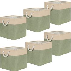 set of four storage bins with handles in light green and beige fabric, one for laundry