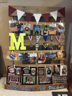 a display case with many pictures and ribbons on the front, along with other memorabilia