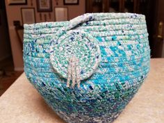 a blue and white basket sitting on top of a counter