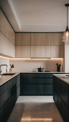 a kitchen with wooden cabinets and black counter tops