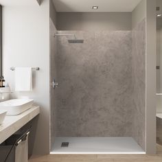 a bathroom with a walk in shower next to a sink